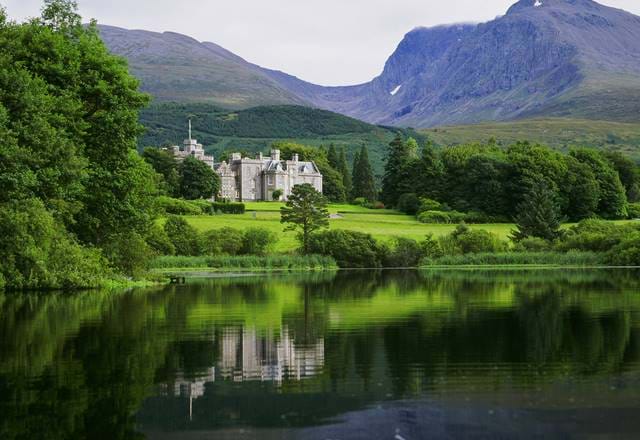 Exterior view of Inverlochy Castle Hotel from across the water