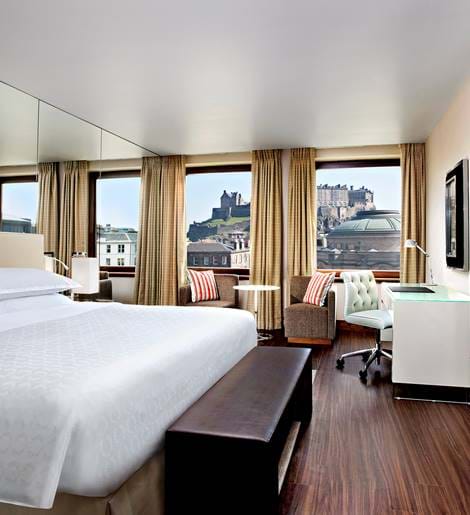 Bedroom at the Sheraton Grand Hotel & Spa with a view of Edinburgh Castle.