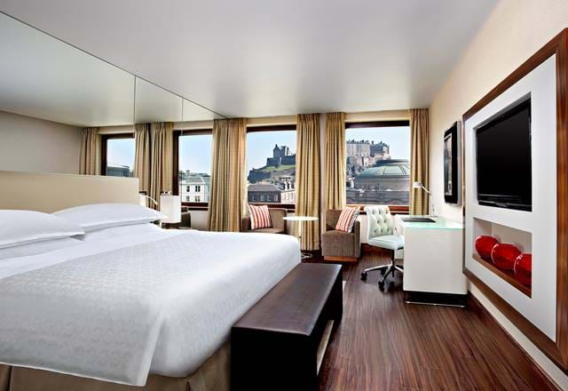 Bedroom at the Sheraton Grand Hotel & Spa with a view of Edinburgh Castle.