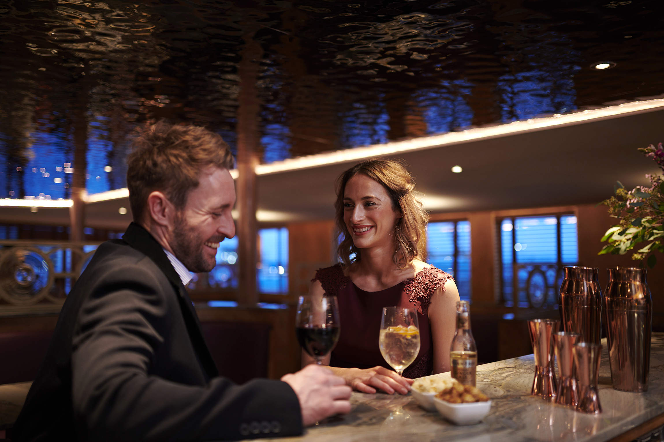 Two people enjoying cocktails at Fingal cocktail bar