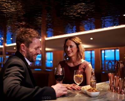 Two people enjoying cocktails at Fingal cocktail bar