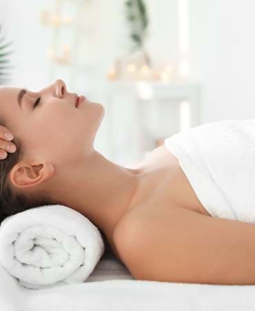 Woman having a head massage in a spa